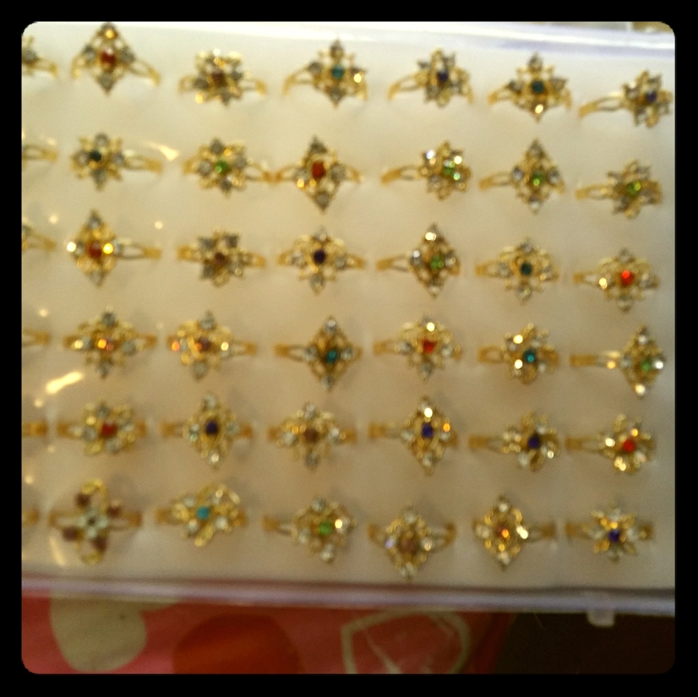 Case of 48 ladies fashion rings size small.